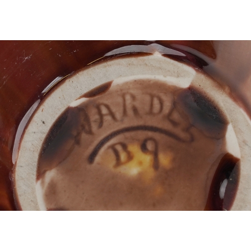 1656 - A pair of early 20th century Wardle pottery vases, each with a red and pink abstract glaze, bearing ... 