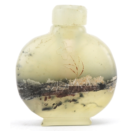 1835 - A Chinese green hardstone snuff bottle with engraved decoration, 6cm high.