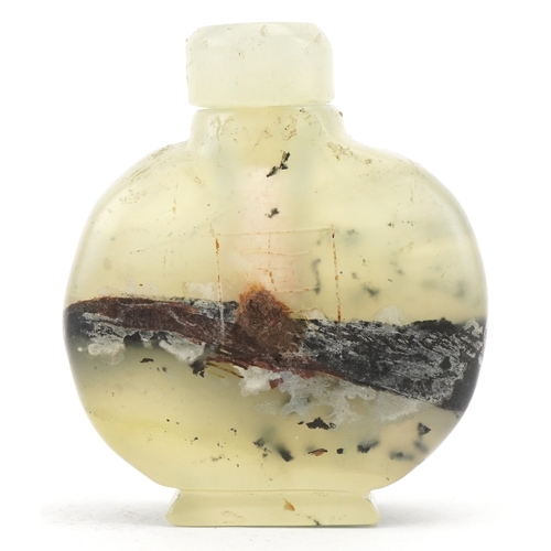 1835 - A Chinese green hardstone snuff bottle with engraved decoration, 6cm high.