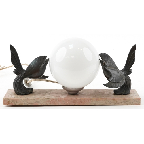 217 - An Art Deco marble desk light with globular glass shade, mounted with birds, 38cm wide.