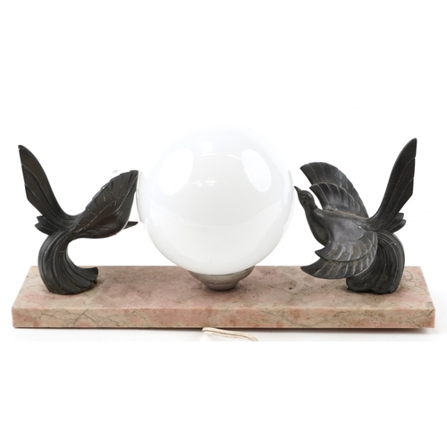 217 - An Art Deco marble desk light with globular glass shade, mounted with birds, 38cm wide.