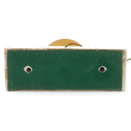  An Art Deco aluminium and glass Pierrot figural table lamp with amber frosted glass shade, raised on... 