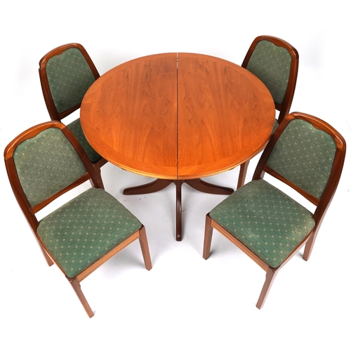 2047 - A late 20th century Nathan Furniture teak extending dining table and four matching chairs, the table... 
