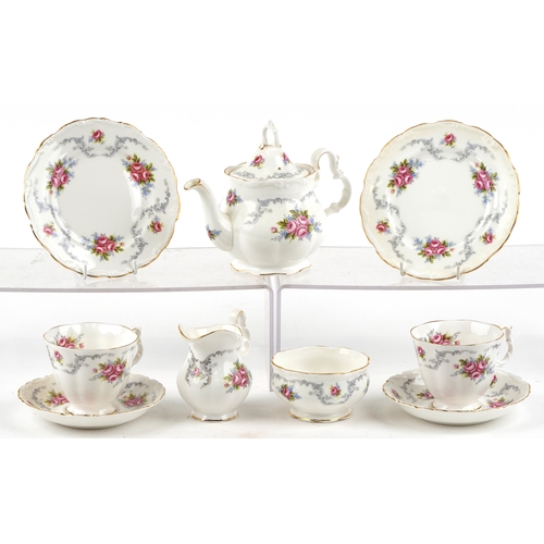 652 - A Royal Albert tea service in the Tranquility pattern including a teapot and two trios, the largest ... 