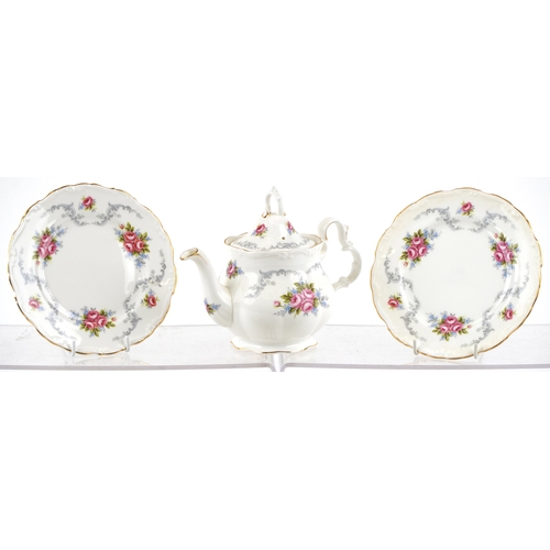 652 - A Royal Albert tea service in the Tranquility pattern including a teapot and two trios, the largest ... 
