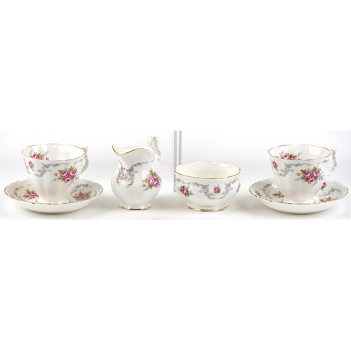 652 - A Royal Albert tea service in the Tranquility pattern including a teapot and two trios, the largest ... 