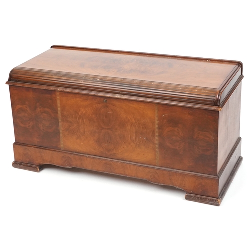 2123 - An early 20th century American walnut blanket box with inlaid decoration, on block feet, 56cm H x 11... 