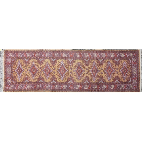2205 - A Indian runner, late 20th century, the mustard field with a central row of medallions within a comp... 