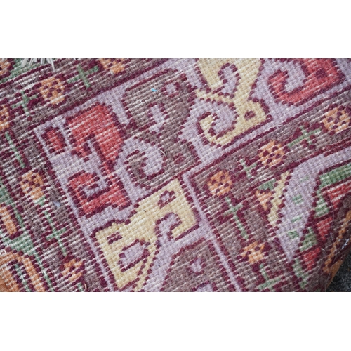 2205 - A Indian runner, late 20th century, the mustard field with a central row of medallions within a comp... 