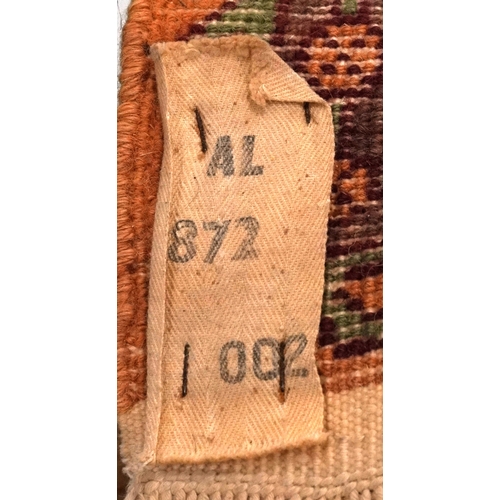 2205 - A Indian runner, late 20th century, the mustard field with a central row of medallions within a comp... 