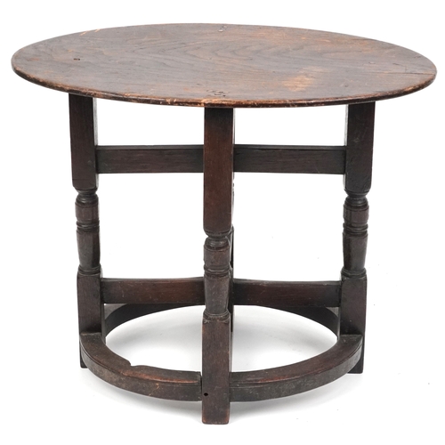 2150 - A late Victorian oak oval occasional table raised on turned and block supports, 59cm H x 72cm W x 46... 