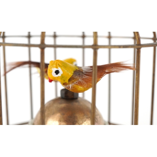 1674 - A clockwork automaton bird cage alarm clock, 16cm high.