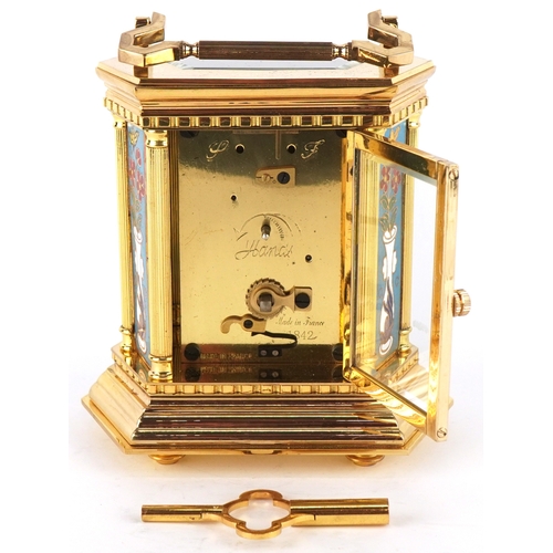 127 - A French brass cased and champlevé enamel carriage clock, the white enamelled dial with black Roman ... 