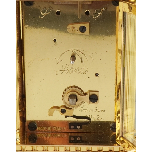 127 - A French brass cased and champlevé enamel carriage clock, the white enamelled dial with black Roman ... 