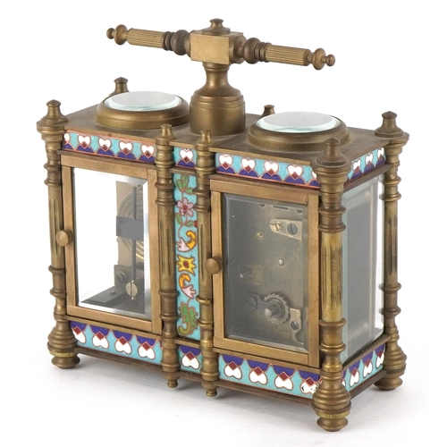 134 - A champlevé enamel brass cased travelling timepiece with clock and barometer, 14cm high.