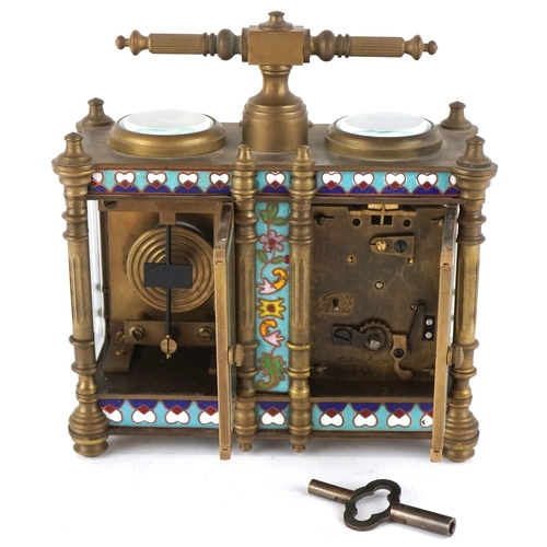 134 - A champlevé enamel brass cased travelling timepiece with clock and barometer, 14cm high.