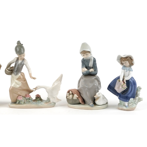 602 - Five Lladro porcelain figures including a seated girl with a goose and goslings 1267, a young girl w... 