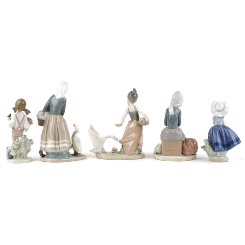 602 - Five Lladro porcelain figures including a seated girl with a goose and goslings 1267, a young girl w... 