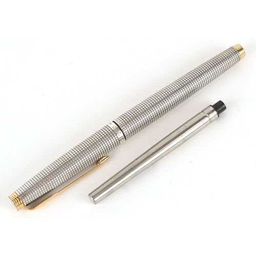 64 - Parker, a sterling silver engine turned fountain pen with 14K gold nib, 13cm in length.