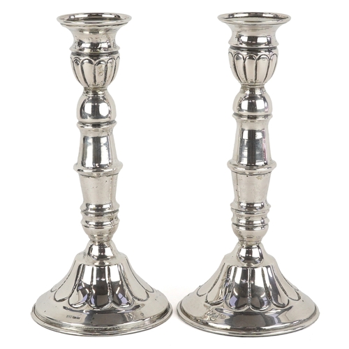 45 - A pair of 830 grade Cyprus silver candlesticks with embossed decoration, KAL maker's mark, 18.5cm hi... 