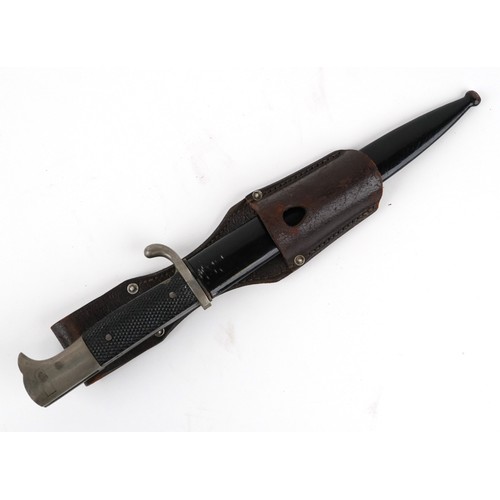 2847 - A German military interest bayonet and scabbard with a leather frog, the blade engraved A Evertz Sol... 