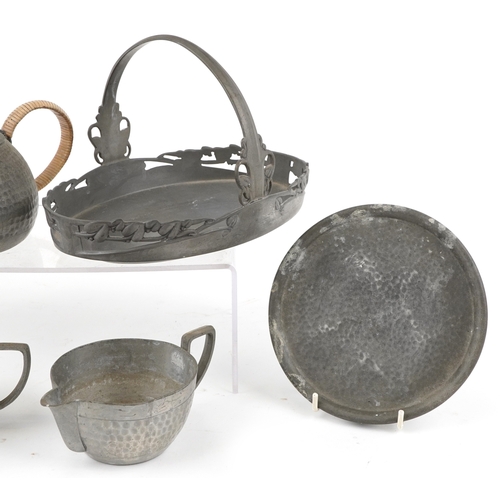 1559 - A small group of early 20th century pewter items including a teapot, salver, milk jug, sugar bowl di... 
