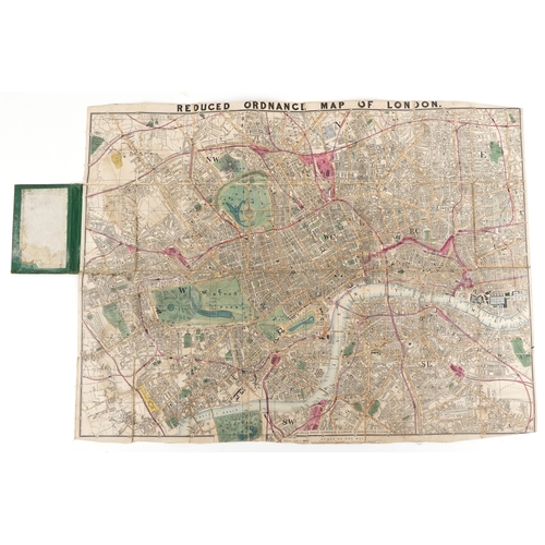 1321 - An early 20th century Reduced Ordnance Map of London housed in a hardback book, 67cm x 90cm.
