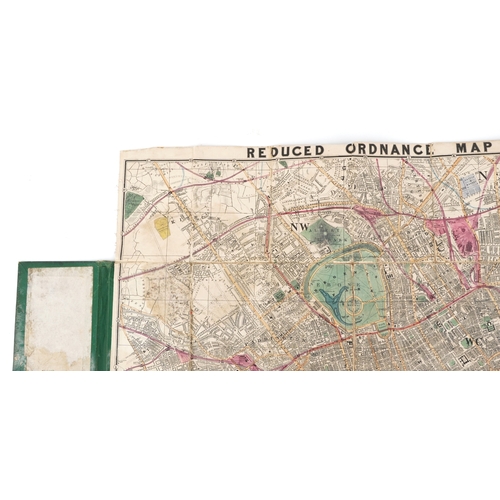 1321 - An early 20th century Reduced Ordnance Map of London housed in a hardback book, 67cm x 90cm.