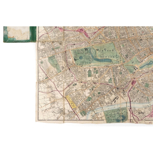 1321 - An early 20th century Reduced Ordnance Map of London housed in a hardback book, 67cm x 90cm.