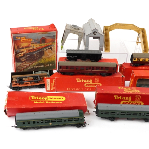 702 - Tri-ang OO gauge model railway carriages, buildings and accessories, some with boxes, including Stat... 