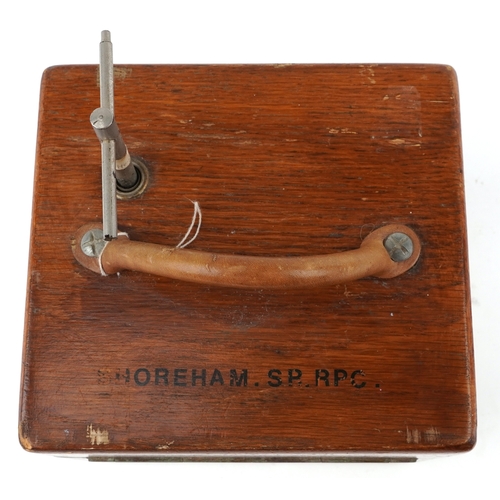  An early to mid 20th century oak cased Benzing pigeon clock supplied by B Leefe & Sons, the lid insc... 