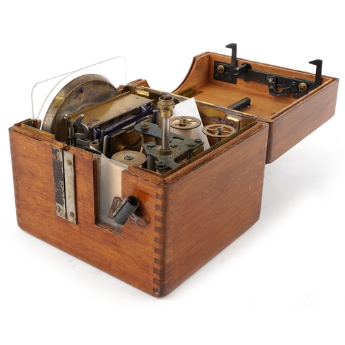  An early to mid 20th century oak cased Benzing pigeon clock supplied by B Leefe & Sons, the lid insc... 