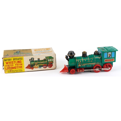722 - A Marx whistling lighted piston locomotive battery operated plastic toy train, 33cm wide, boxed.