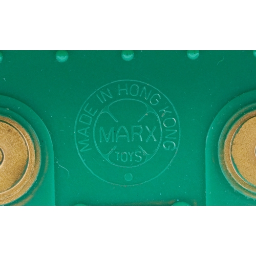 722 - A Marx whistling lighted piston locomotive battery operated plastic toy train, 33cm wide, boxed.