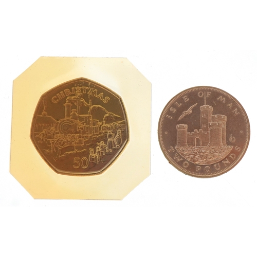1164 - An Isle of Man Christmas 1984 fifty pence piece and an Isle of Man two pound coin, the fifty pence b... 