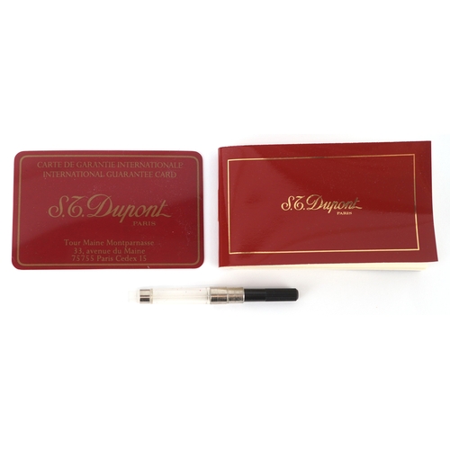 78 - An S T Dupont silver plated fountain pen with 18ct gold nib and box, 14cm in length.