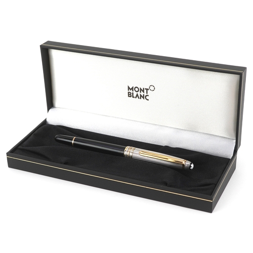 72 - Montblanc, a Montblanc Meisterstuck ballpoint pen with 925 silver and gold cap, with box and paperwo... 
