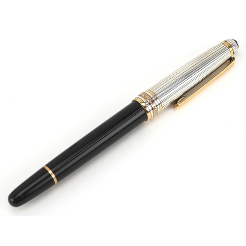72 - Montblanc, a Montblanc Meisterstuck ballpoint pen with 925 silver and gold cap, with box and paperwo... 
