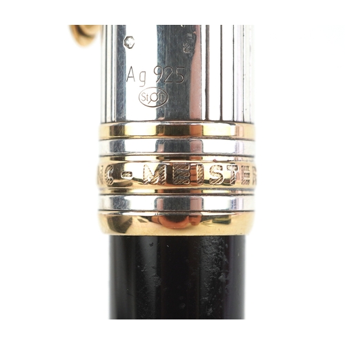 72 - Montblanc, a Montblanc Meisterstuck ballpoint pen with 925 silver and gold cap, with box and paperwo... 