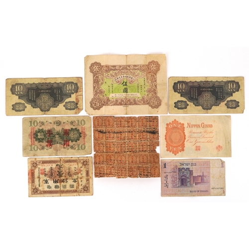 1189 - A small quantity of vintage Japanese and Chinese banknotes to include The Republic of China Military... 