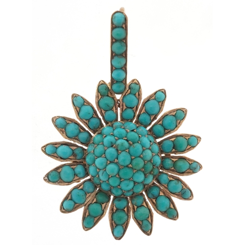 An unmarked gold cabochon turquoise flower head pendant, 4.1cm high, 7.6g.