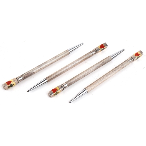 32 - Four sterling silver and enamel propelling bridge pencils housed in a fitted case, the pencils 9cm i... 