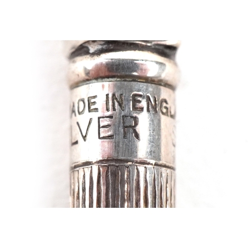 32 - Four sterling silver and enamel propelling bridge pencils housed in a fitted case, the pencils 9cm i... 