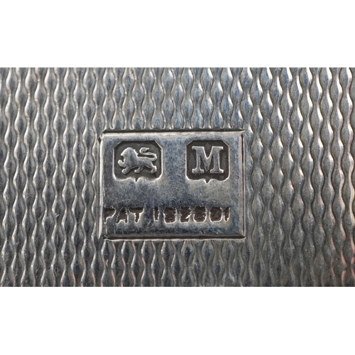 59 - An unusual Art Deco engine turned silver folding card case with gold monogram, indistinct maker, Bir... 