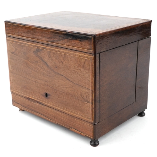 20 - An early 19th century rosewood and boxwood line inlaid table top decanter box, the hinged lid housin... 