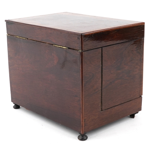 20 - An early 19th century rosewood and boxwood line inlaid table top decanter box, the hinged lid housin... 