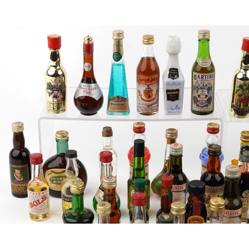 14 - A large collection of vintage and later alcohol miniatures including Martini Gin, Drambuie, Bols Che... 