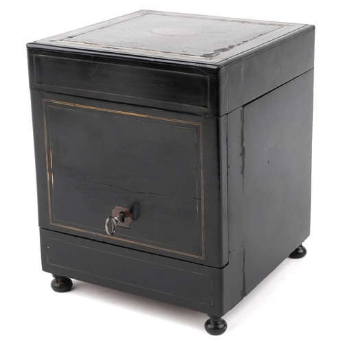 21 - A mid Victorian ebonised table top drinks cabinet with brass inlaid stringing, the hinged top reveal... 