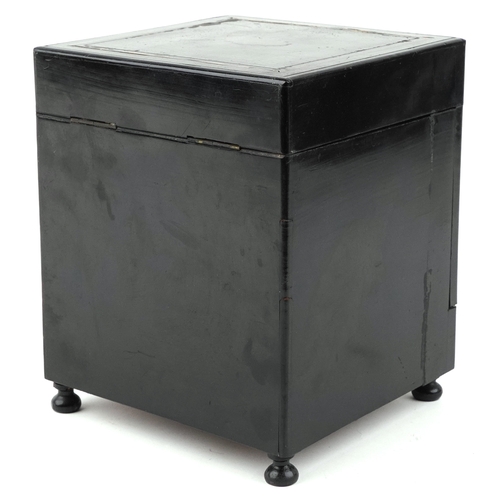 21 - A mid Victorian ebonised table top drinks cabinet with brass inlaid stringing, the hinged top reveal... 