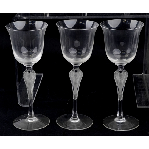 22 - A set of twelve Igor Carl Fabergé glasses with nude female frosted glass stems, by the Franklin mint... 